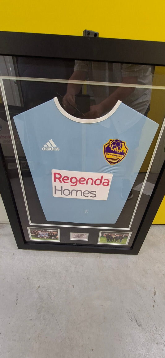 Season 21/22 Framed Away Shirt, invoking our first ever game and NWCFL Premier Division Title win